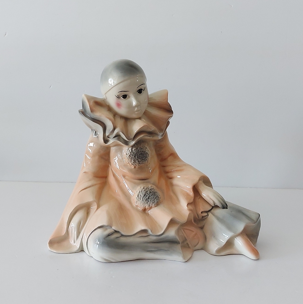 Pierrot, harlequin clown with ballet shoes.